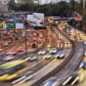 Photo of multi lane highway with cars at dusk