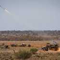 An Australian Army NASAMS High-Mobility Launcher fires a Sidewinder missile during a live-fire certification activity at Woomera Test Range, South Australia.
