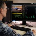 Air Force Imagery Specialist, Flight Sergeant Michael Bott searches for aircraft using an algorithim that he has helped produced while involved in the Edgy-Air Force program.