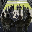 Royal Australian Air Force personnel from 35 Squadron brief United States Army soldiers before they board a Royal Australian Air Force C-27J Spartan during Exercise Croix Du Sud 2023.