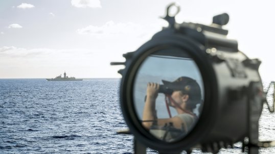 Seaman Boatswains Mate Brianna Donnelly observes HMAS Toowoomba during Regional Presence Deployment 26‑1.