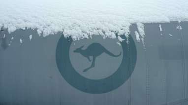 Snow sitting on RAAF roundel on aircraft