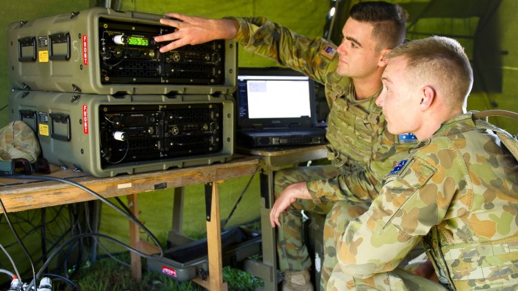 Signallers Nathan Milnes and Jordan Jessen from 7th Combat Signal Regiment work with Integrated Battlefield Telecommunications Network equipment on Exercise Carbon Diamond.