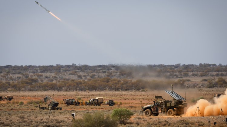 An Australian Army NASAMS High-Mobility Launcher fires a Sidewinder missile during a live-fire certification activity at Woomera Test Range, South Australia.