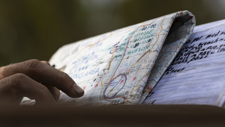 Australian Army officer Lieutenant Jackson Say from 3rd Combat Engineer Regiment, reads command notes on a map during a live fire M58 Mine Clearing Line Charge (MICLIC) Serial at Townsville Field Training Area, Queensland, on 06 September 2025.